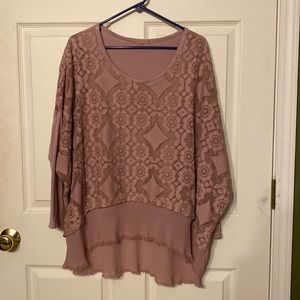 Pullover shirt is made of chiffon like material & a layer of lace over that.